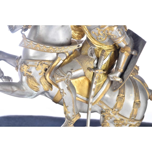 471 - A pair of parcel gilt and silvered metal equestrian warrior figures, 20th century, modelled as a med... 