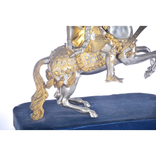 471 - A pair of parcel gilt and silvered metal equestrian warrior figures, 20th century, modelled as a med... 