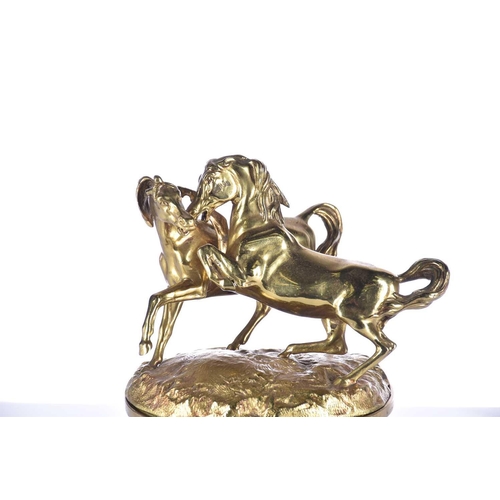 474 - A mid 19th century gilt bronze oversized desk inkwell, the cover with two fighting wild horses, the ... 