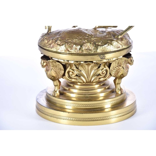 474 - A mid 19th century gilt bronze oversized desk inkwell, the cover with two fighting wild horses, the ... 