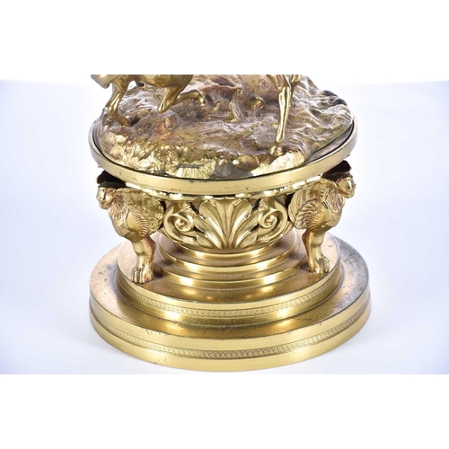 474 - A mid 19th century gilt bronze oversized desk inkwell, the cover with two fighting wild horses, the ... 