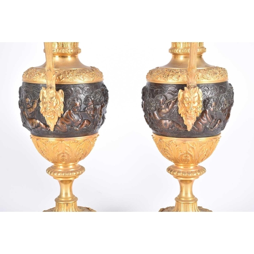 479 - A pair of renaissance revival bronze and fire gilt ewers, after Claude Michel Clodion, 20th century,... 