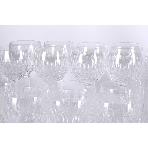 486 - A suite of seventy Waterford Crystal Colleen pattern drinking glasses and a pair of decanters, for e... 