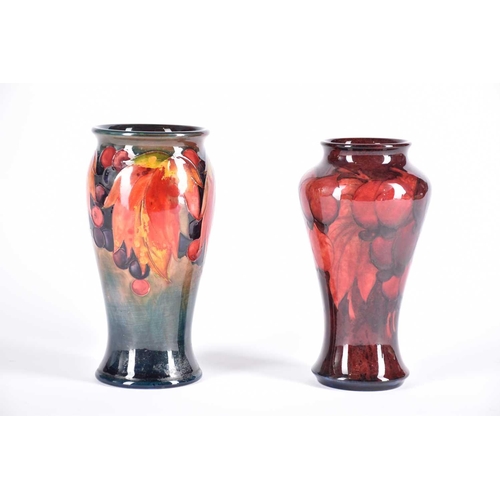 488 - A 20th Century Moorcroft flambe wisteria vase and a Moorcroft flambe leaf & berries vase, both signe... 