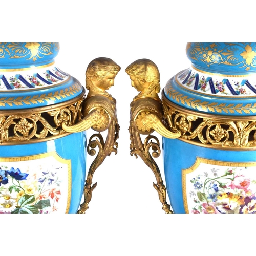 494 - A large pair of Sevres ormolu mounted pedestal vases and covers, 19th century, the compressed bell s... 