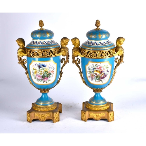 494 - A large pair of Sevres ormolu mounted pedestal vases and covers, 19th century, the compressed bell s... 