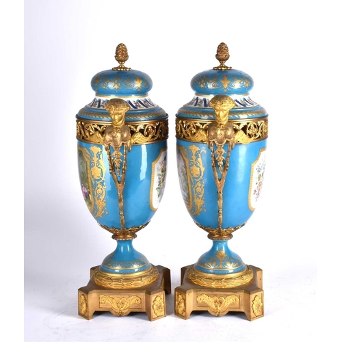 494 - A large pair of Sevres ormolu mounted pedestal vases and covers, 19th century, the compressed bell s... 