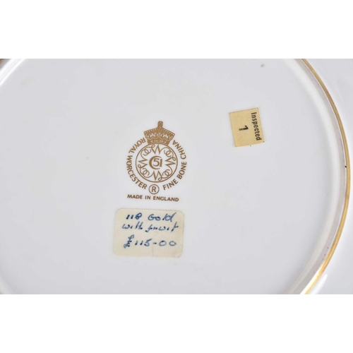 499 - A Royal Worcester hand painted and acid gilt cabinet plate and tazza, circa 1970, each painted with ... 