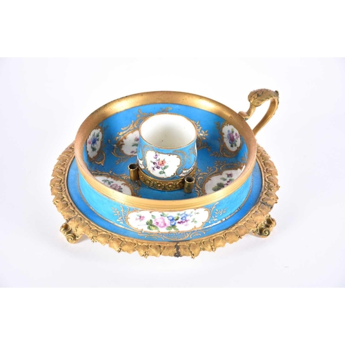 502 - A Sevres style porcelain and gilt metal mounted inkwell,19th century, the central bulb shaped cup wi... 