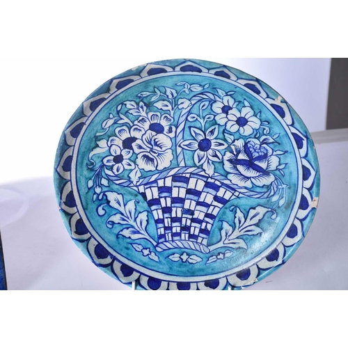 510 - A group of five Iznik-style items consists of three tiles, the largest 25cm square, the smallest til... 