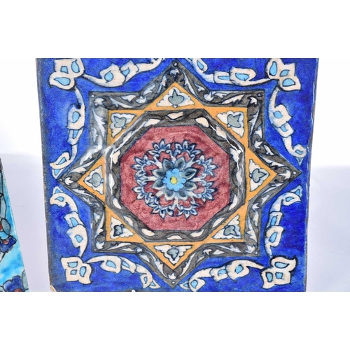 510 - A group of five Iznik-style items consists of three tiles, the largest 25cm square, the smallest til... 