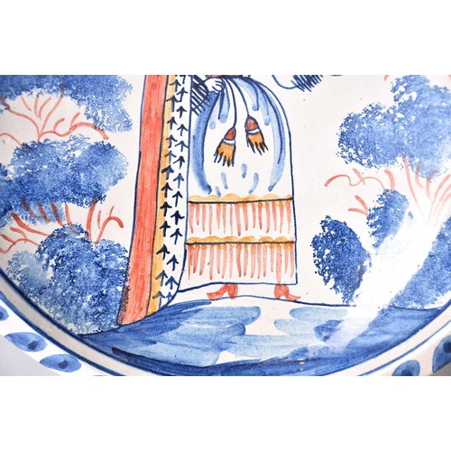 513 - A 19th-century circular French faience blue and white dish with ochre dressed rim 35 cm together wit... 