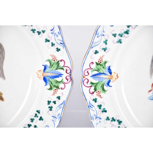 514 - A pair of large 19th Century Austrian porcelain dishes/chargers with Beehive mark to reverse, hand-p... 