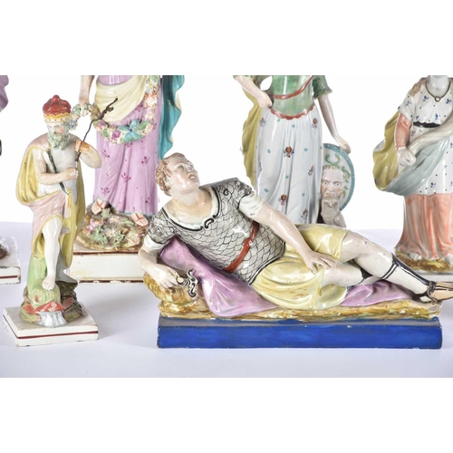 518 - A collection of early 19th century Staffordshire pearlware figures, including an Enoch Wood figure o... 