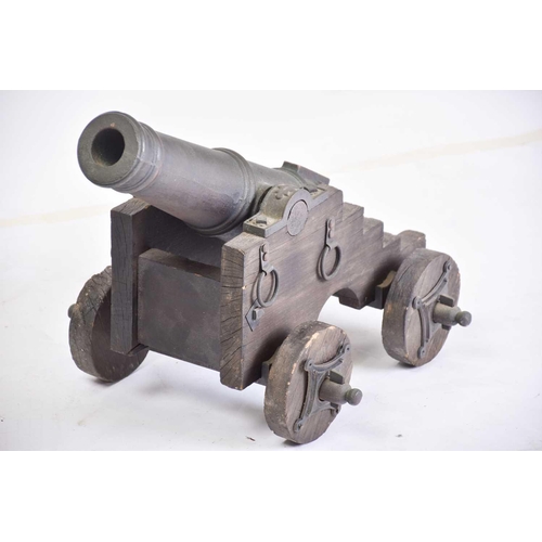 531 - A pair of ornamental cast-iron miniature signal canons on wheeled carriages. 54 cm long x 30 cmPriva... 