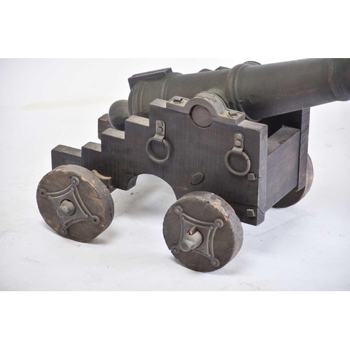 531 - A pair of ornamental cast-iron miniature signal canons on wheeled carriages. 54 cm long x 30 cmPriva... 