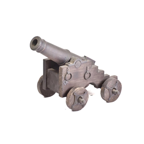 531 - A pair of ornamental cast-iron miniature signal canons on wheeled carriages. 54 cm long x 30 cmPriva... 