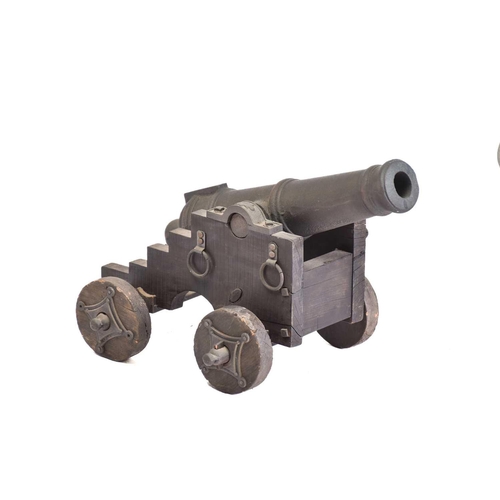 531 - A pair of ornamental cast-iron miniature signal canons on wheeled carriages. 54 cm long x 30 cmPriva... 