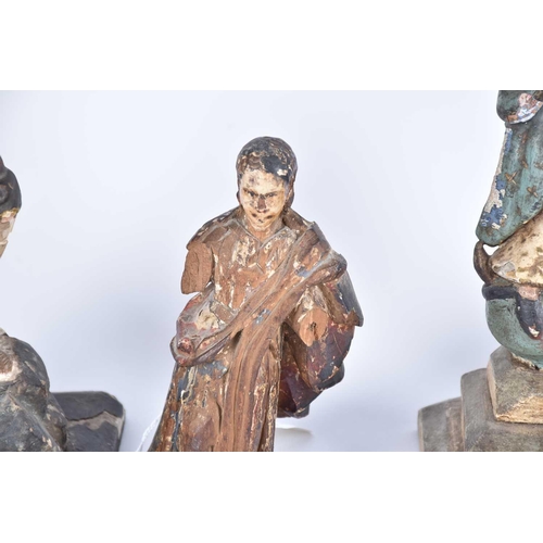 540 - An 18th-century Limewood figure of a Saint with traces of polychromic paint 19 cm high together with... 