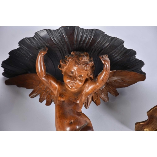 541 - A pair of 20th Century carved wood wall sconces in the form of cherubs, a rococo style giltwood wall... 