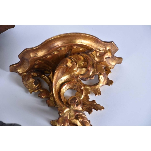 541 - A pair of 20th Century carved wood wall sconces in the form of cherubs, a rococo style giltwood wall... 