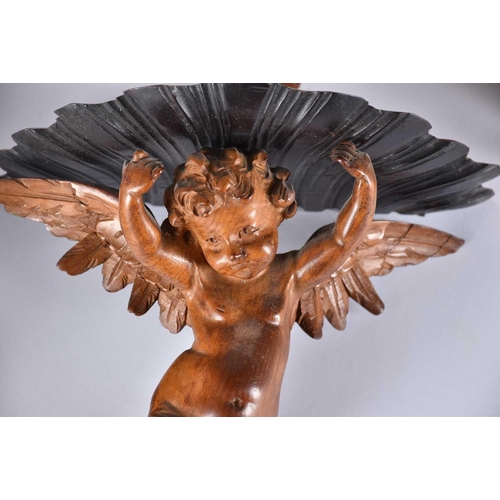 541 - A pair of 20th Century carved wood wall sconces in the form of cherubs, a rococo style giltwood wall... 