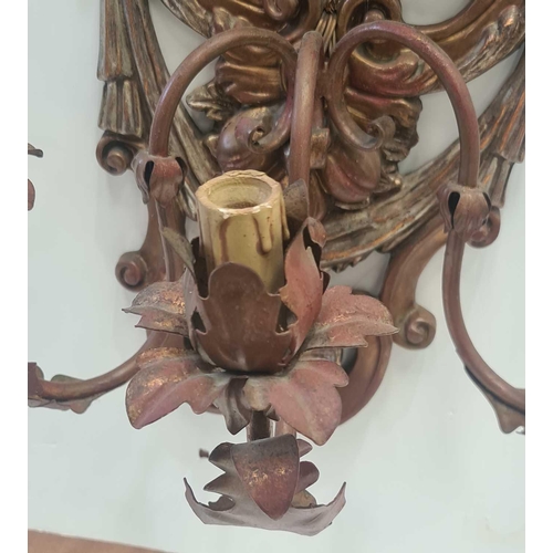 543 - A pair of carved and gilt Italianate Baroque three branch wall sconce with hanging fruit satyrs mask... 