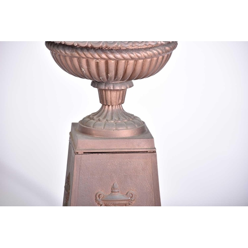 545 - A pair of decorative cast iron circular tazza with egg and tongue rims and square bases, on separate... 