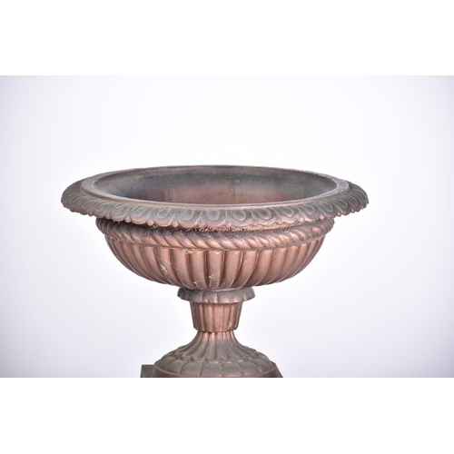 545 - A pair of decorative cast iron circular tazza with egg and tongue rims and square bases, on separate... 