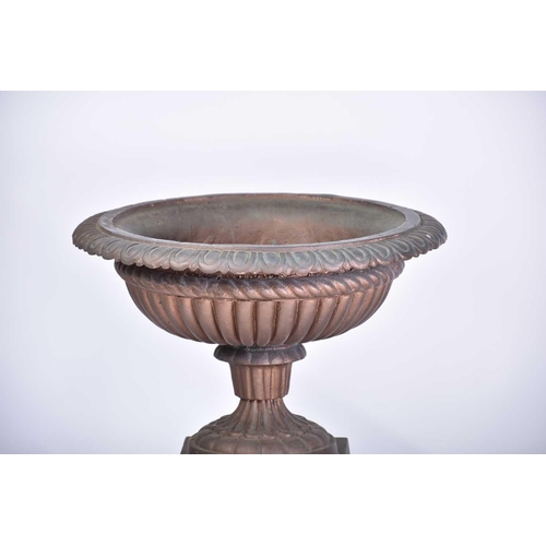 545 - A pair of decorative cast iron circular tazza with egg and tongue rims and square bases, on separate... 