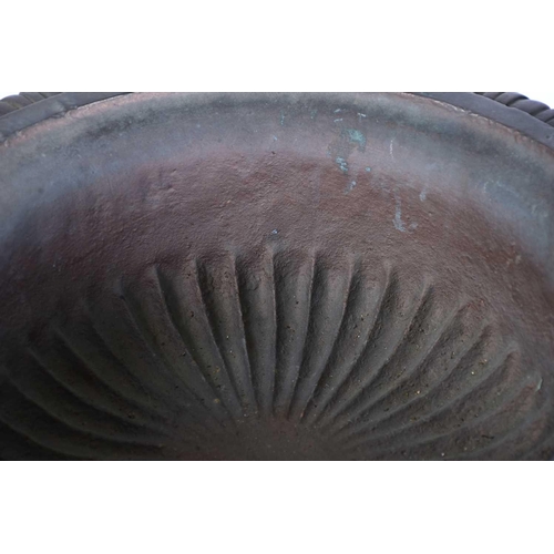 545 - A pair of decorative cast iron circular tazza with egg and tongue rims and square bases, on separate... 