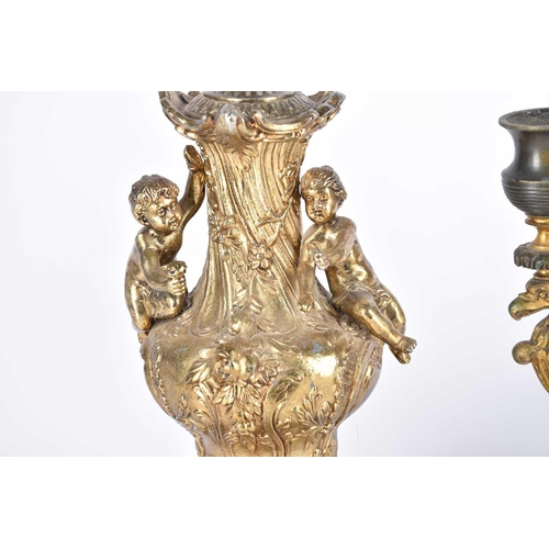 548 - An Empire period three branch candelabra,19th century, the central stem with gilt leaf from arms sus... 