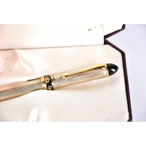 561 - A Regali Regali sterling silver fountain pen designed by Egon von Furstenberg, with black lacquer an... 