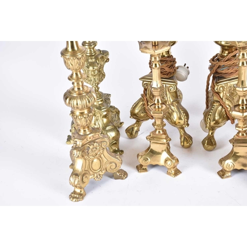 571 - Four pairs of rococo style Dutch brass pricket stands, candlesticks and table lights, 20th century, ... 