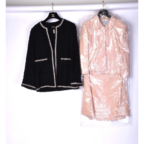 572 - A collection of Chanel couture clothing to include a short buckle jacket with matching skirt (P16222... 