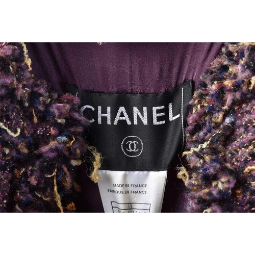 572 - A collection of Chanel couture clothing to include a short buckle jacket with matching skirt (P16222... 