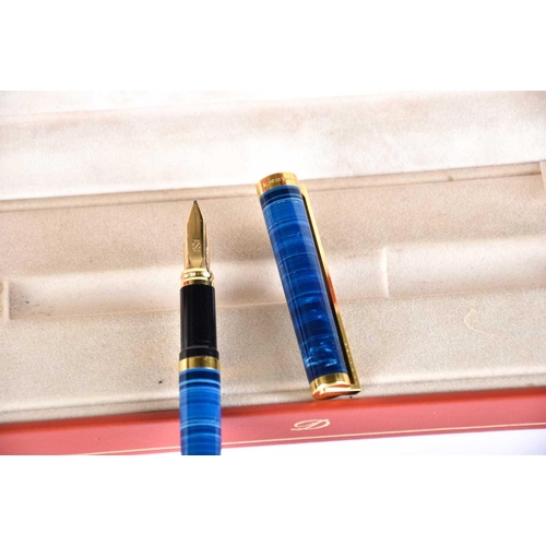 583 - An S T Dupont blue banded Laque de Chine fountain pen, with 18ct gold nib, serial number 44CCA95; an... 