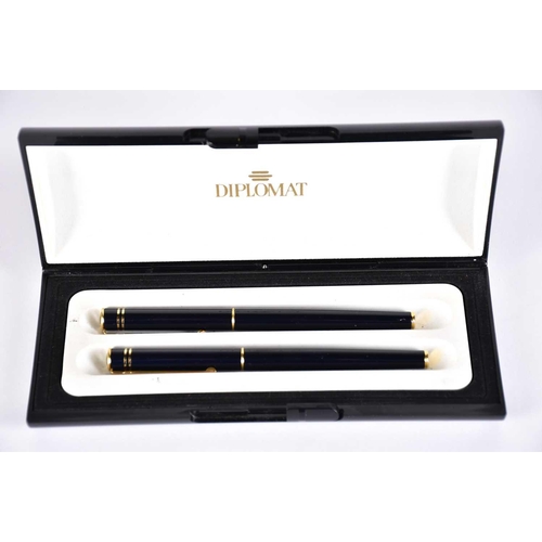 600 - A Waterman's black laquer rollerball pen with matching propelling pencil, two further Waterman ballp... 