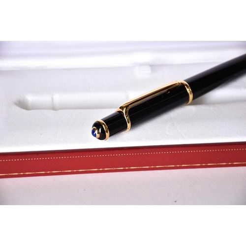 606 - A Diabolo de Cartier ballpoint pen, with blue cabochon, serial number 250610, in presentation case w... 