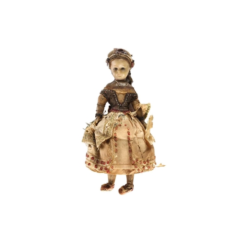 593 - A 19th century poured wax headed doll with inset glass eyes and real hair waxen fabric body limbs, i... 