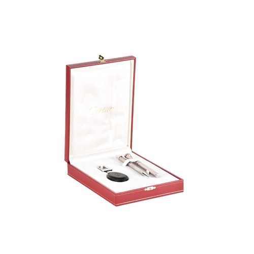 594 - A Must de Cartier writing set, comprising fountain pen, propelling pencil and leather key fob, the w... 