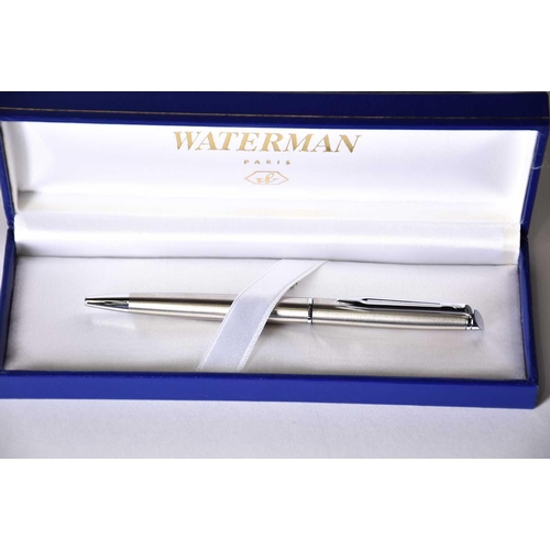 600 - A Waterman's black laquer rollerball pen with matching propelling pencil, two further Waterman ballp... 