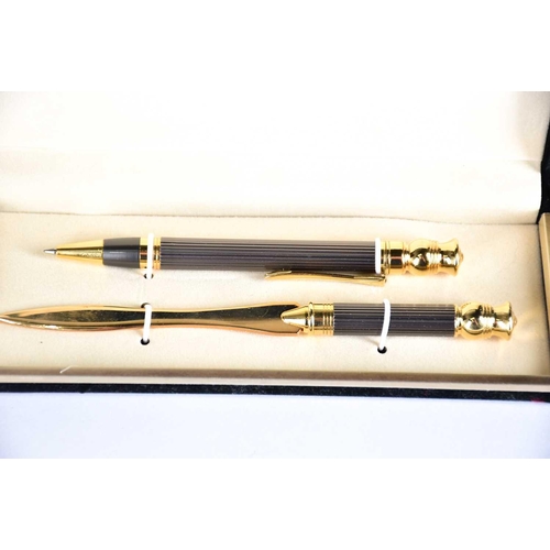 600 - A Waterman's black laquer rollerball pen with matching propelling pencil, two further Waterman ballp... 