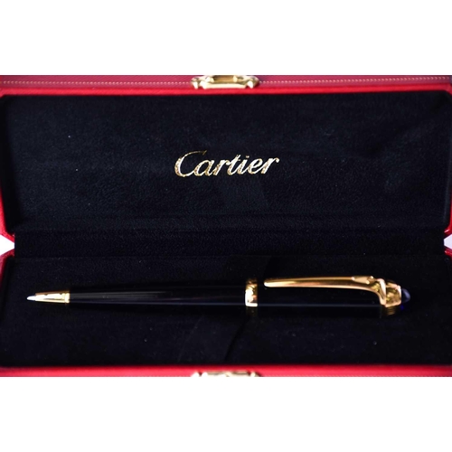 606 - A Diabolo de Cartier ballpoint pen, with blue cabochon, serial number 250610, in presentation case w... 