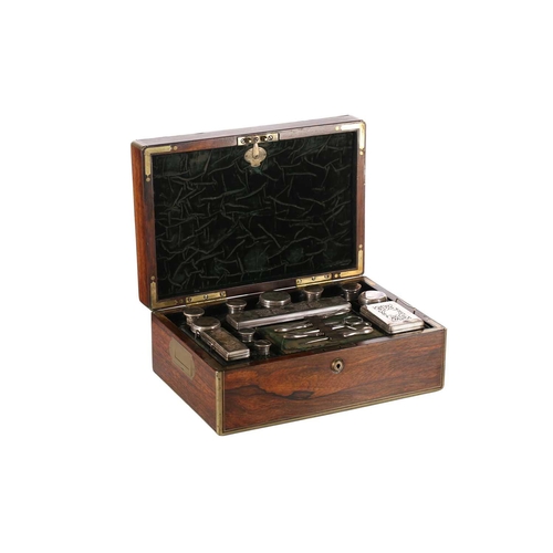 607 - An early 19th-century brass bound figured rosewood dressing case with inset plain entablature and fo... 