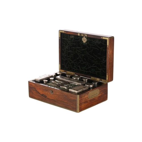 607 - An early 19th-century brass bound figured rosewood dressing case with inset plain entablature and fo... 