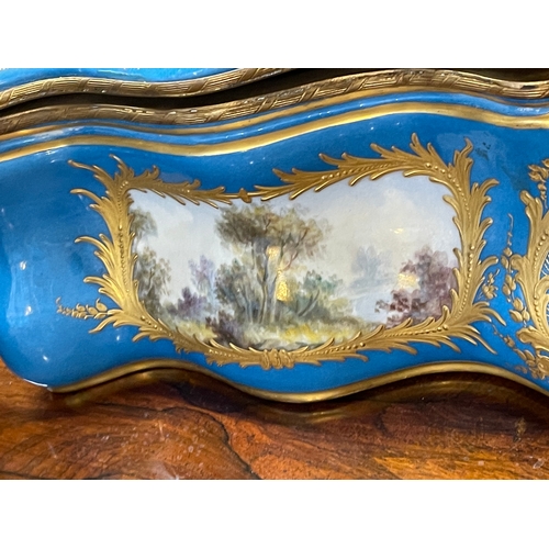 500 - A large Sevres style porcelain bombe casket, late 19th century, painted with Watteau inspired panels... 