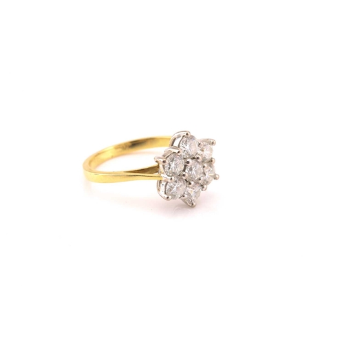 10 - An 18ct gold diamond cluster ring, comprises seven brilliant diamonds with an estimated total weight... 
