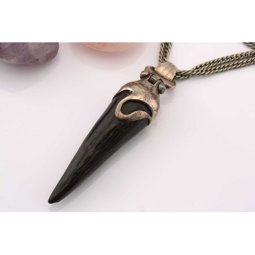 108 - A mixed lot of pendants and brooches, to include a horn pendant on a white metal mount, to a double ... 