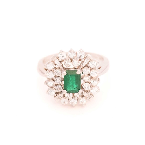 113 - An emerald and colourless sapphire cluster ring, centred with a rectangular emerald in dark green, c... 
